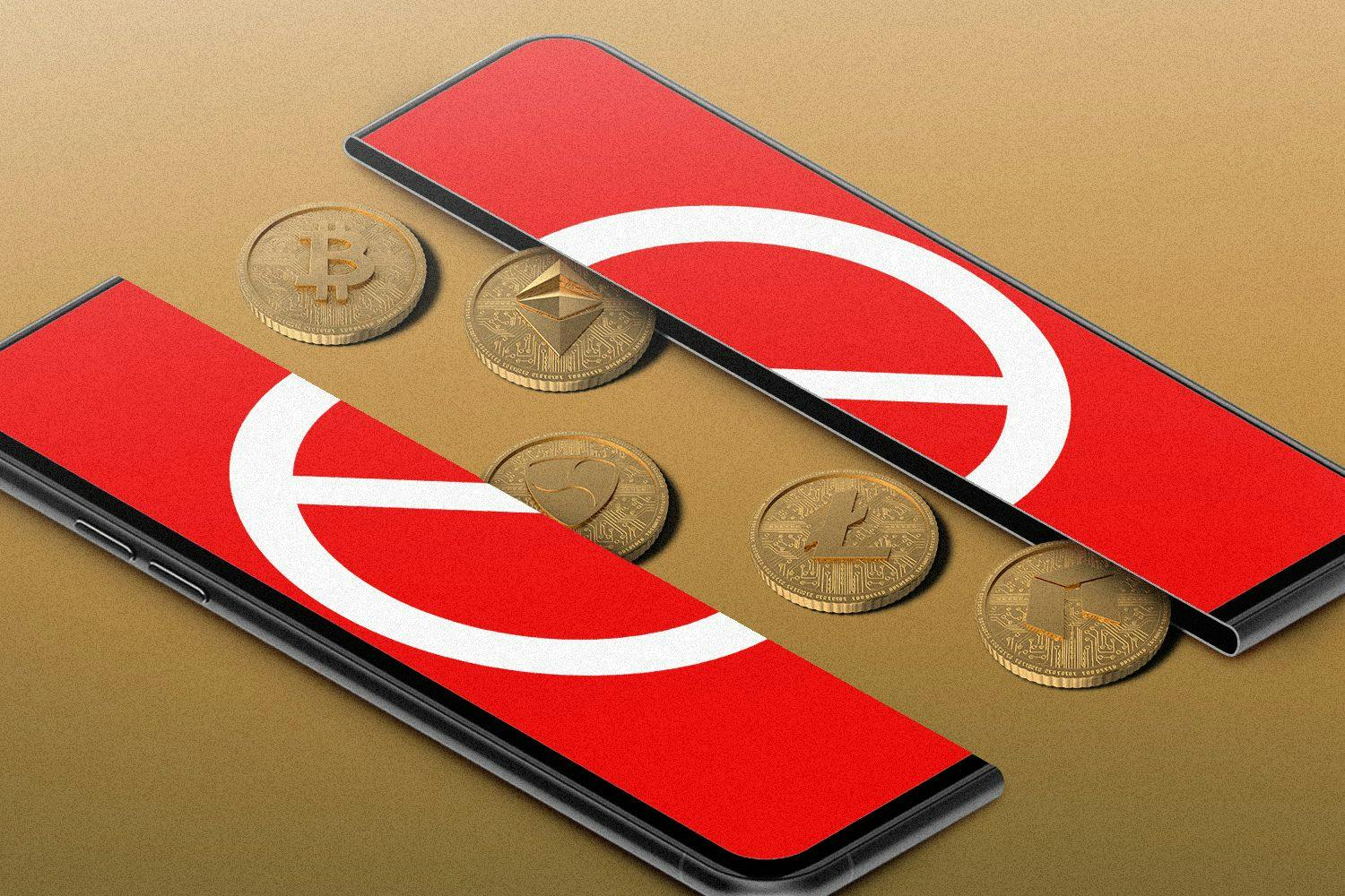 a phone with a "no" sign on it split in half, with crypto coins coming out of it