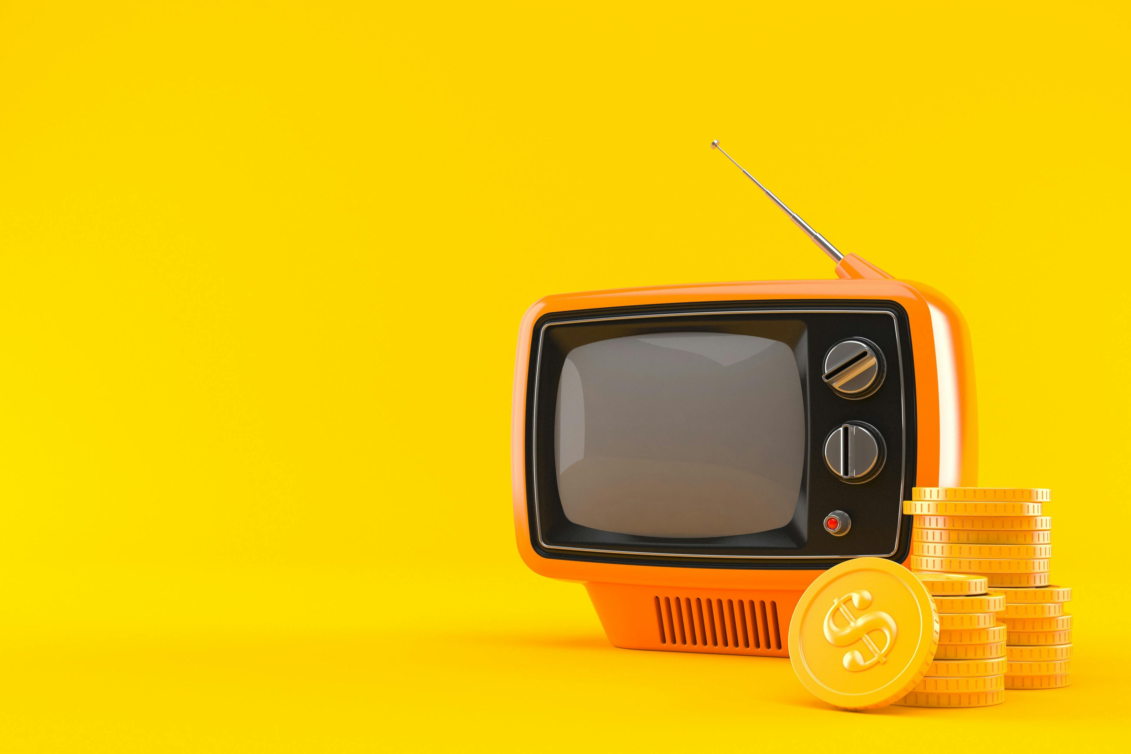 An orange TV set with gold coins stacked next to it in front of a yellow background