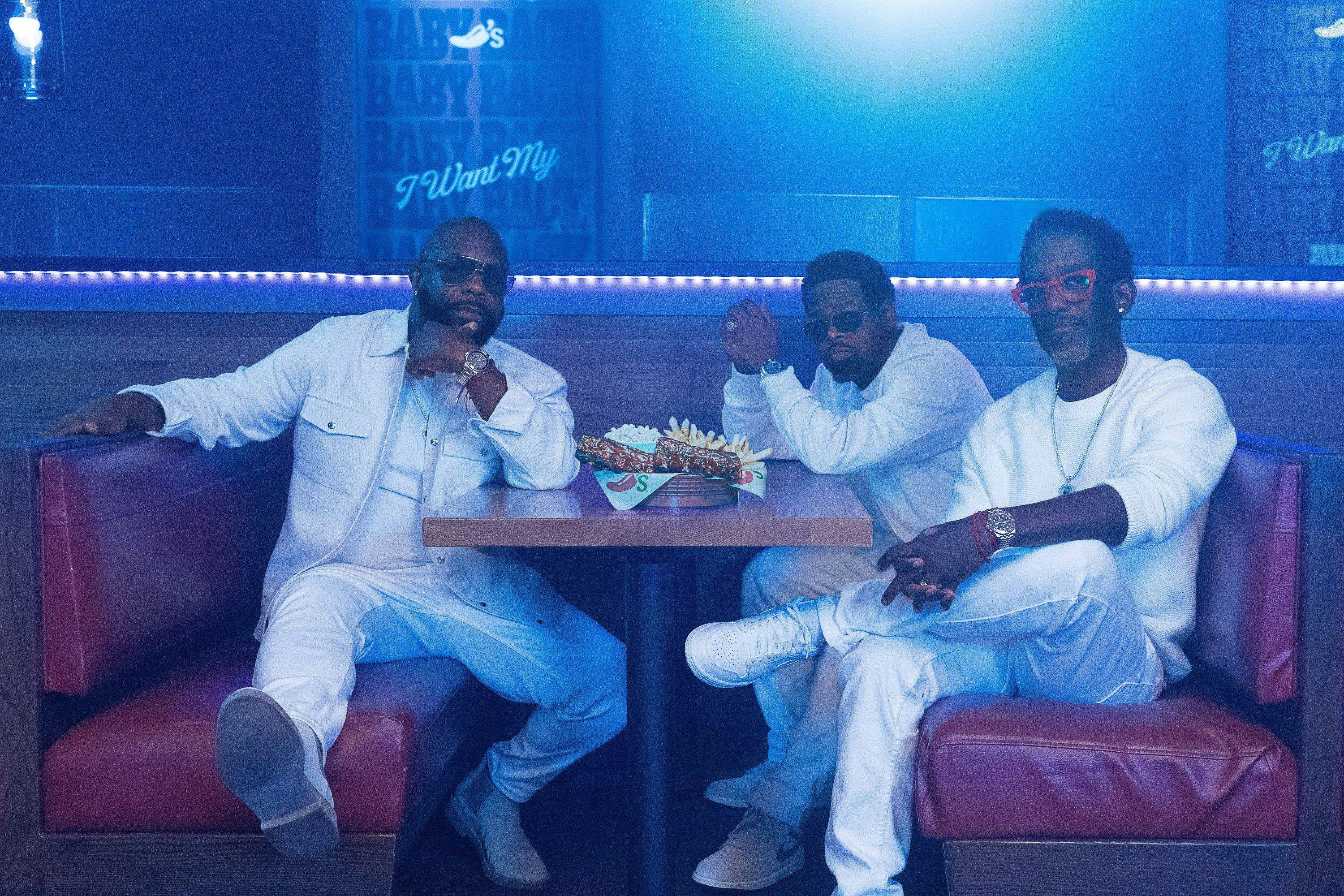 Boyz II Men in a booth at Chili's with baby back ribs